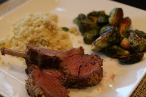 plated with couscous and roasted Brussels sprouts